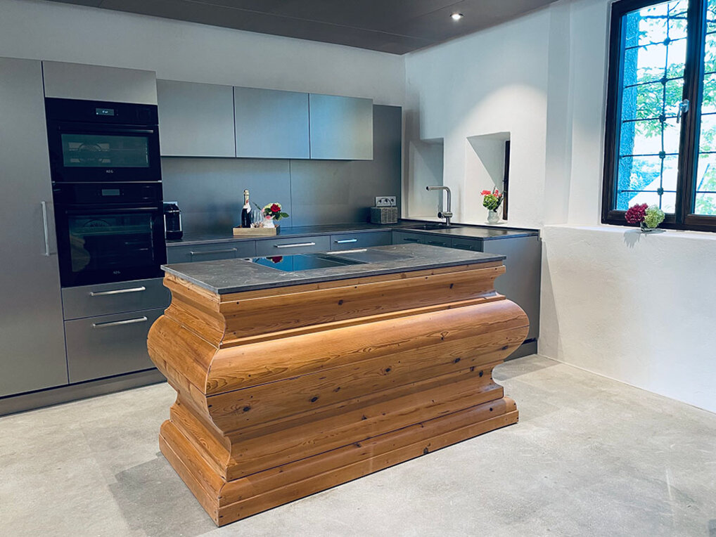 Modern kitchen with a beautiful wooden kitchen block in the center