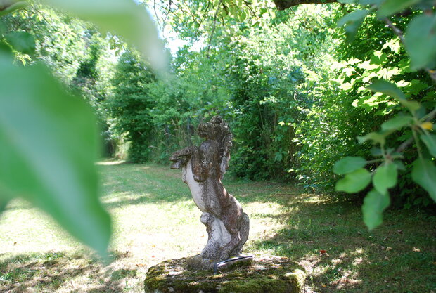 Old statue of a horse in the garden